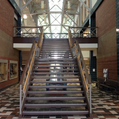Inside the technology building, located on the east side of Central Michigan's campus, a staircase with natural tone of brown sits in the middle of the hallway. Photo by: Jermaine Fields 02/23/2017