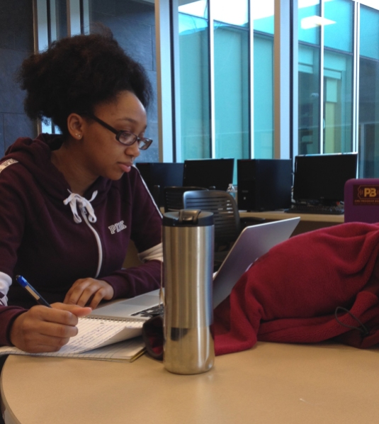 Myiah Willliams, freshman student at CMU, sports a variety of different colors. From here burgundy hoodie to her silver thermos, she expresses her style. Photo by: Jermaine Fields